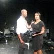 Brittane Rowe as Laura and Chris Gwynn as Junior share a poignant moment.